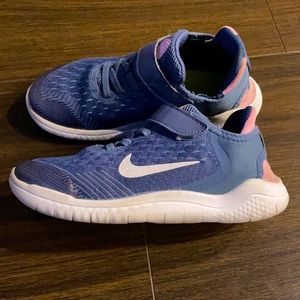 Nike, lots of space for foot, velcro, fairly new